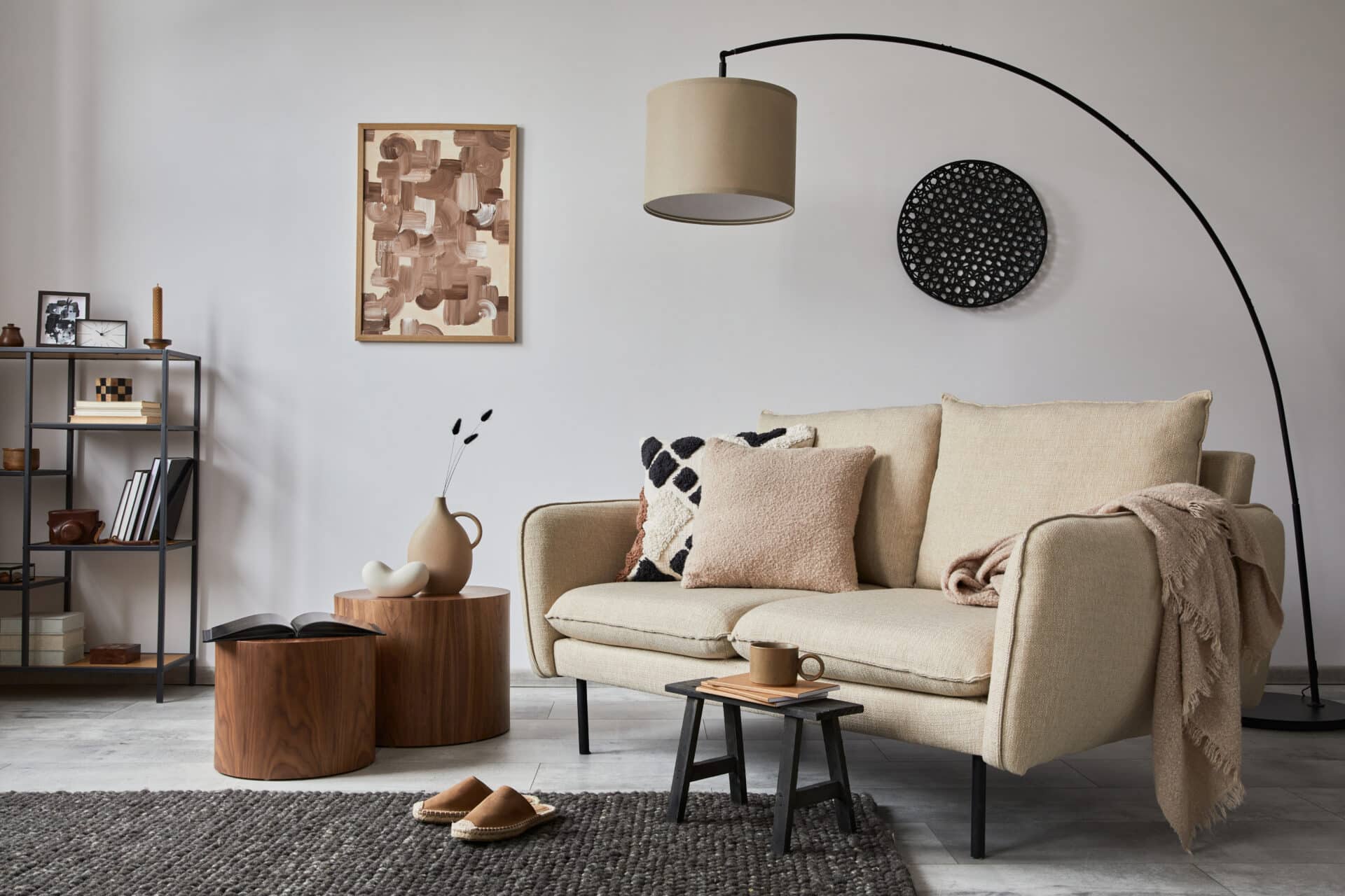 Creative composition of modern living room interior with mock up poster frame, beige sofa, side table and stylish small personal accessories on metal shelf. Cozy home decor. Template. .