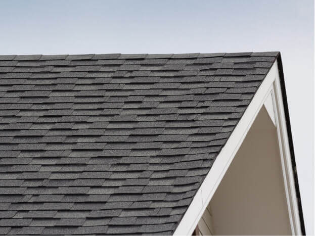 Focused view on brown shingles atop roof